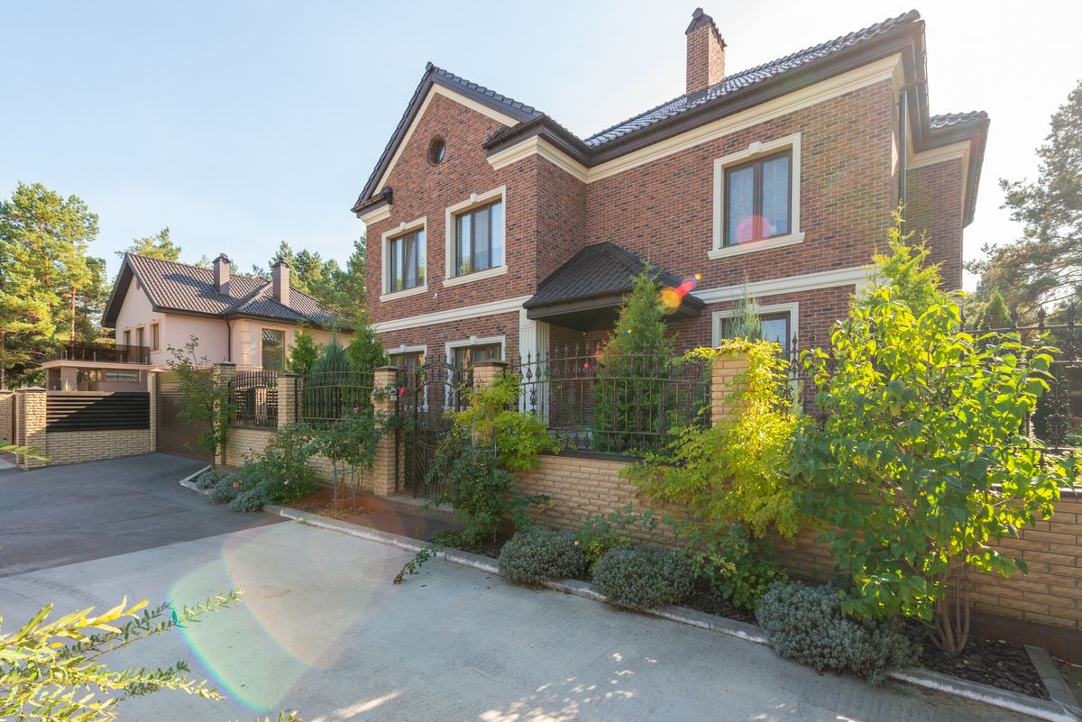 Brick home with automatic driveway gate